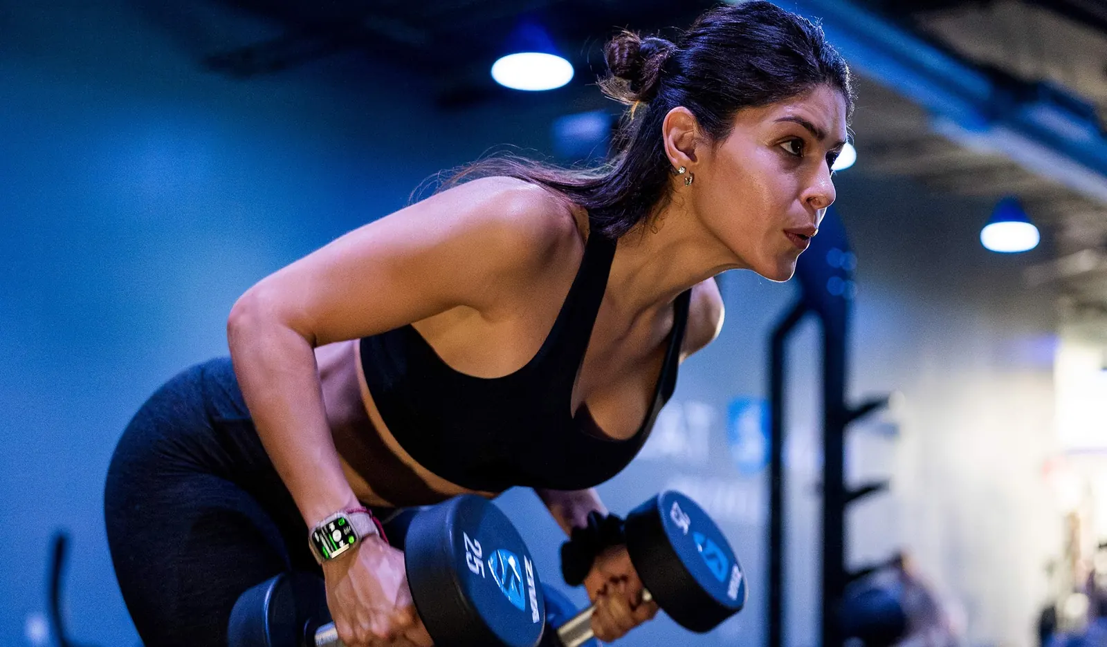 SWEAT440 Toms River member training with dumbbells